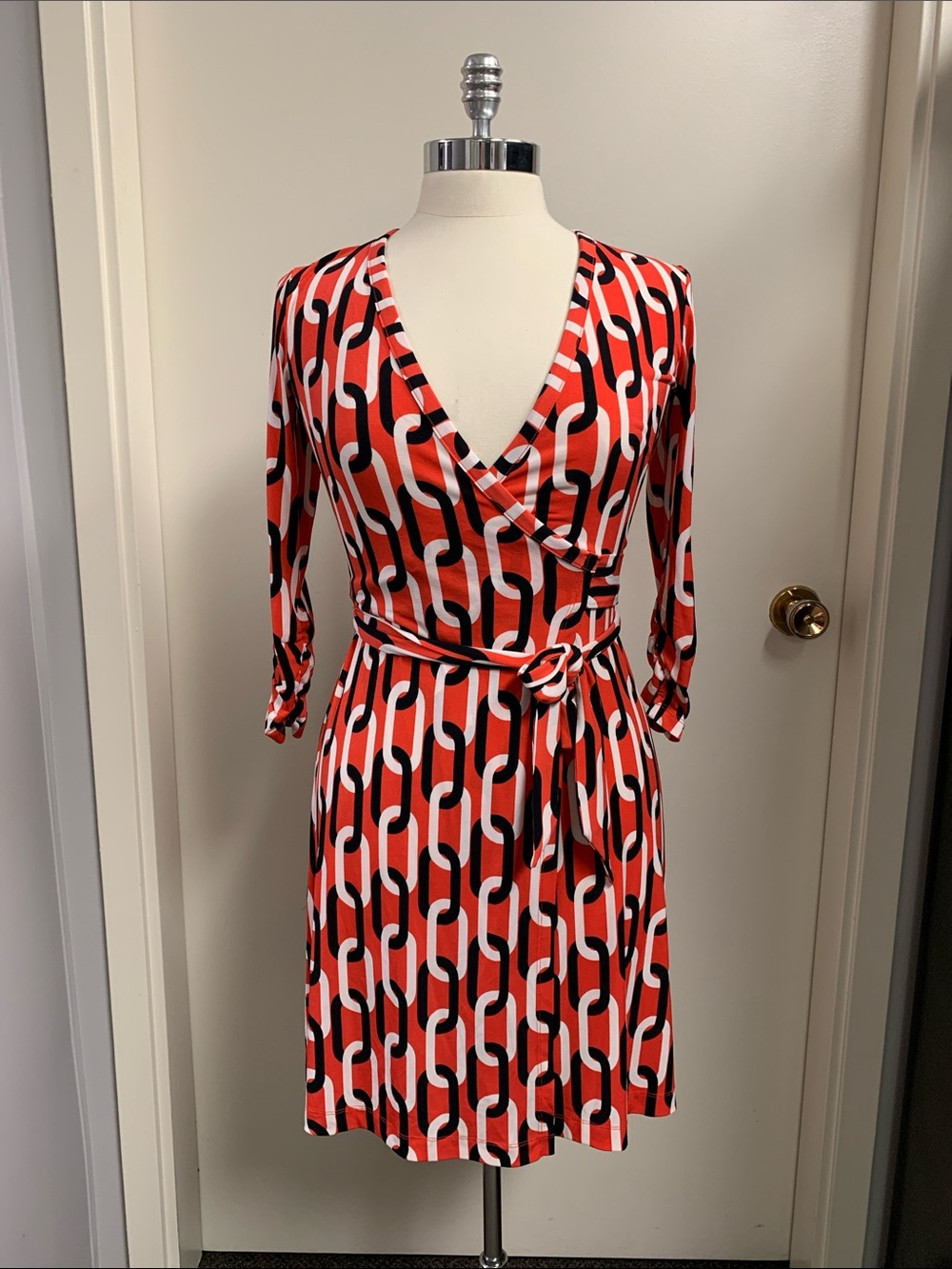 Banana Republic wrap dress featuring black, white, and red chain link graphic.